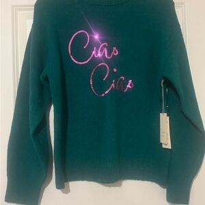 Green Sweater with Pink Accents